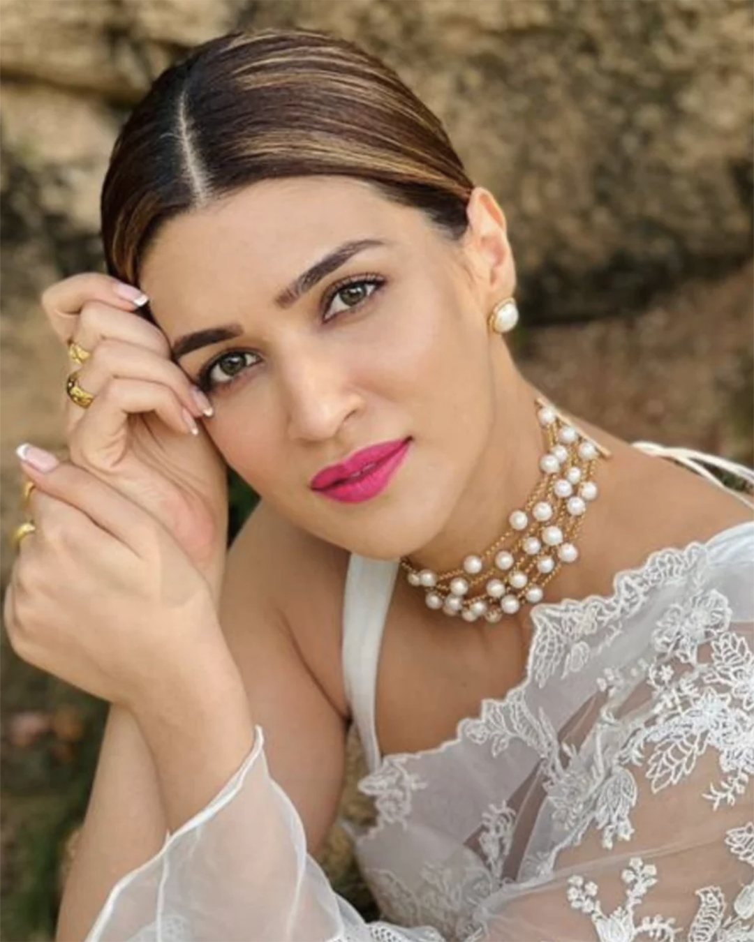 White pearl stud earrings with gold-plated finish