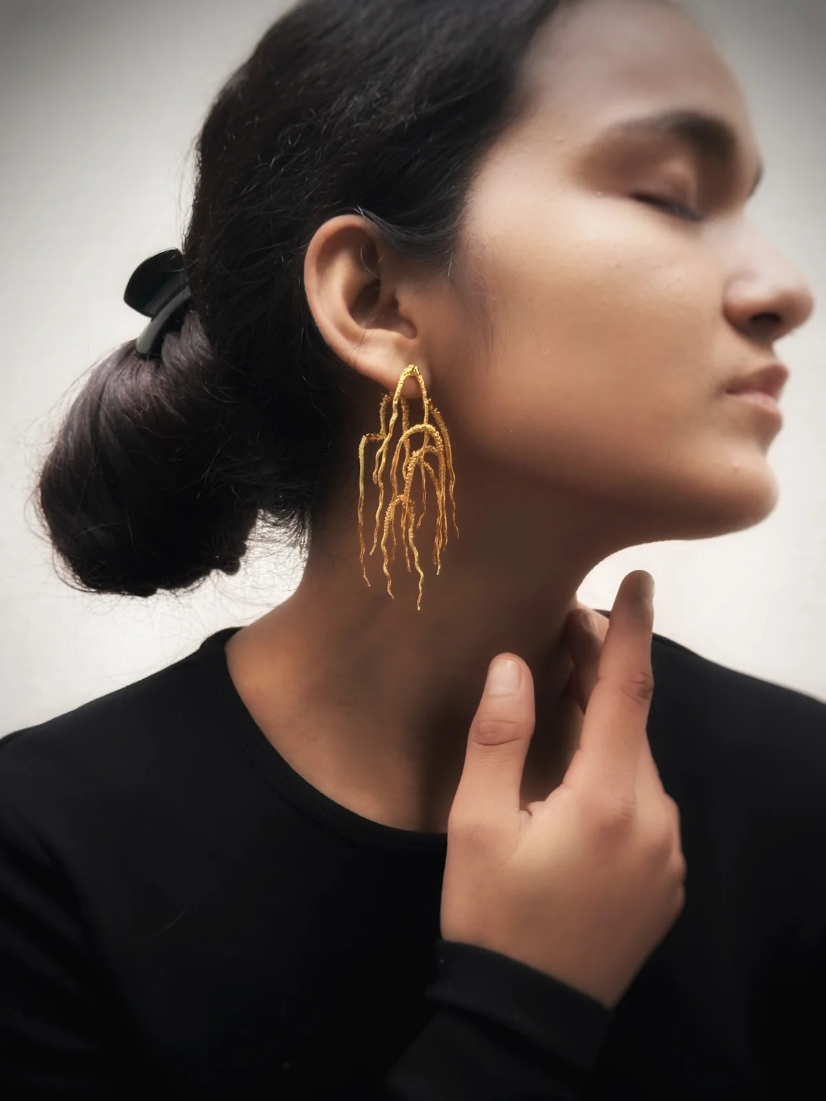 Untamed goddess dangles gold